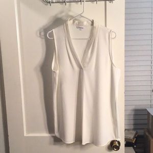 V-neck, sleeveless blouse.